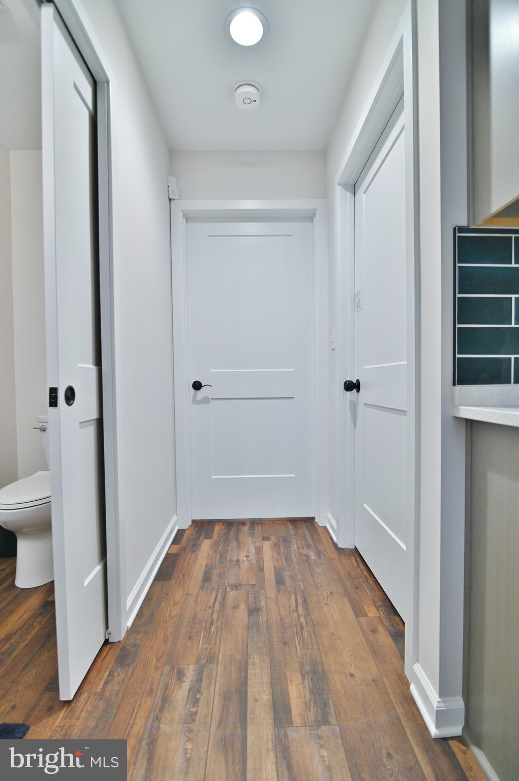 5448 Crooked Run Road Mount Jackson, VA 22842 - Photo 38 of 67 a view of a room with wooden floor and white doors
