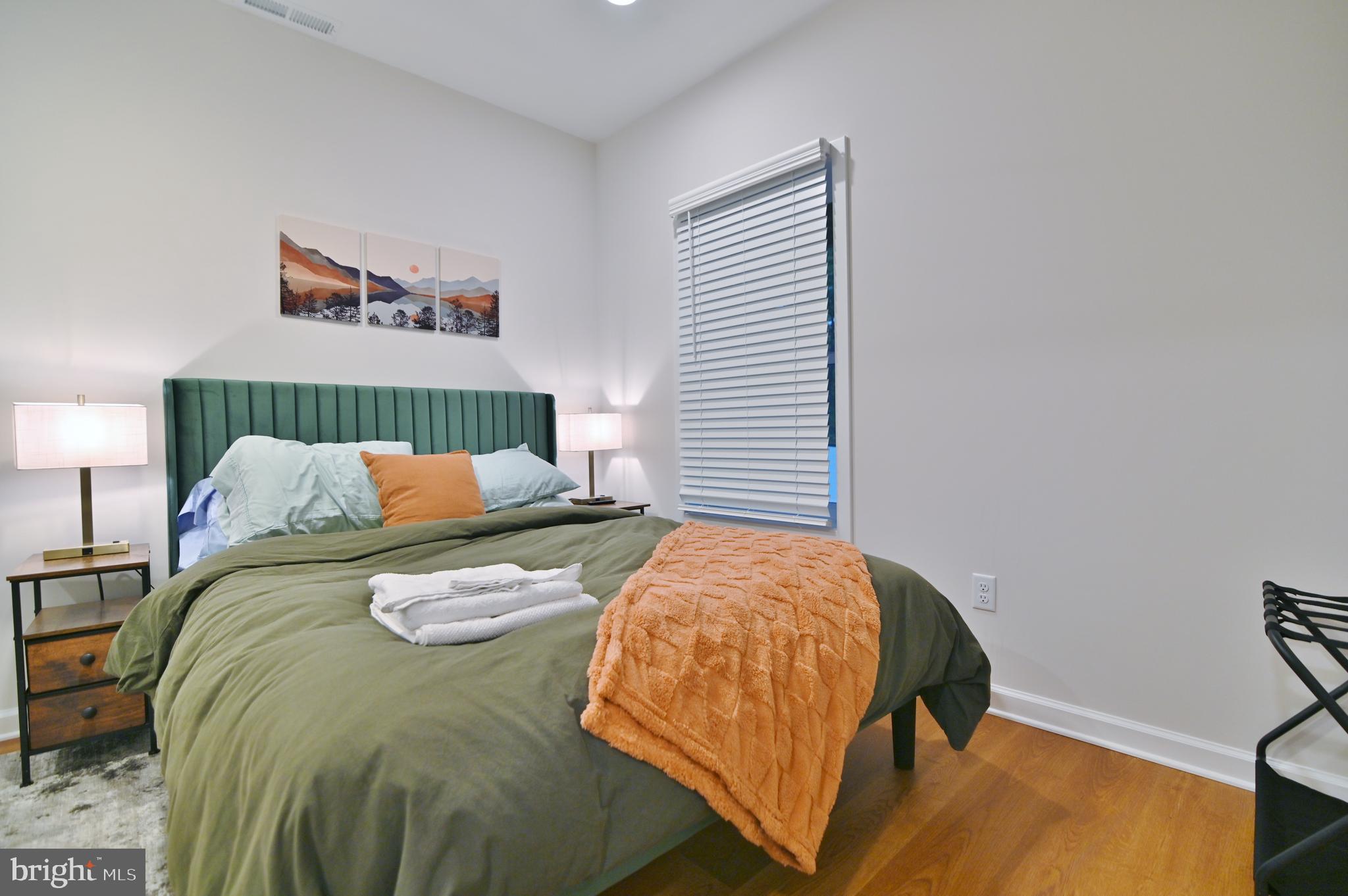 5448 Crooked Run Road Mount Jackson, VA 22842 - Photo 48 of 67 a bed sitting in a bedroom next to a lamp