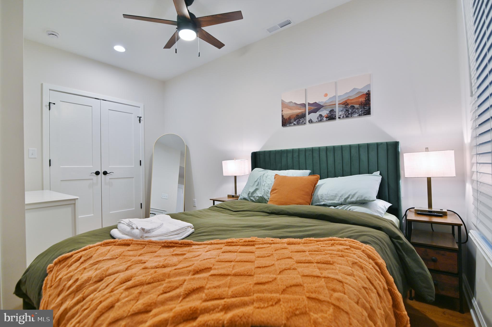 5448 Crooked Run Road Mount Jackson, VA 22842 - Photo 49 of 67 a bedroom with a bed and a lamp