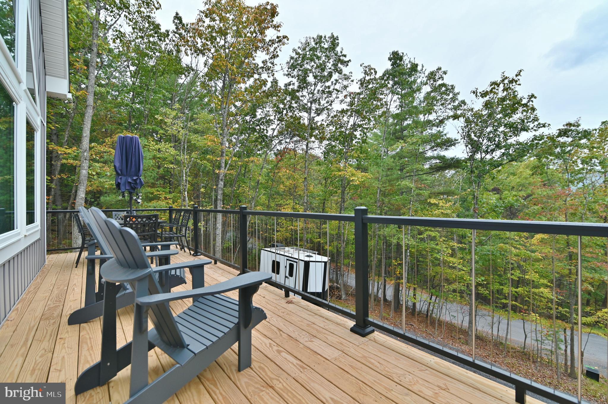 5448 Crooked Run Road Mount Jackson, VA 22842 - Photo 58 of 67 a view of a deck with two chair and wooden floor