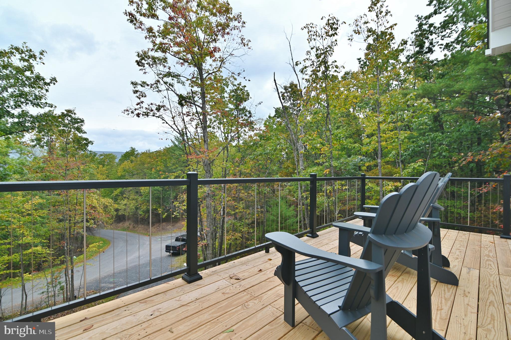 5448 Crooked Run Road Mount Jackson, VA 22842 - Photo 59 of 67 a view of a balcony with wooden floor and outdoor seating