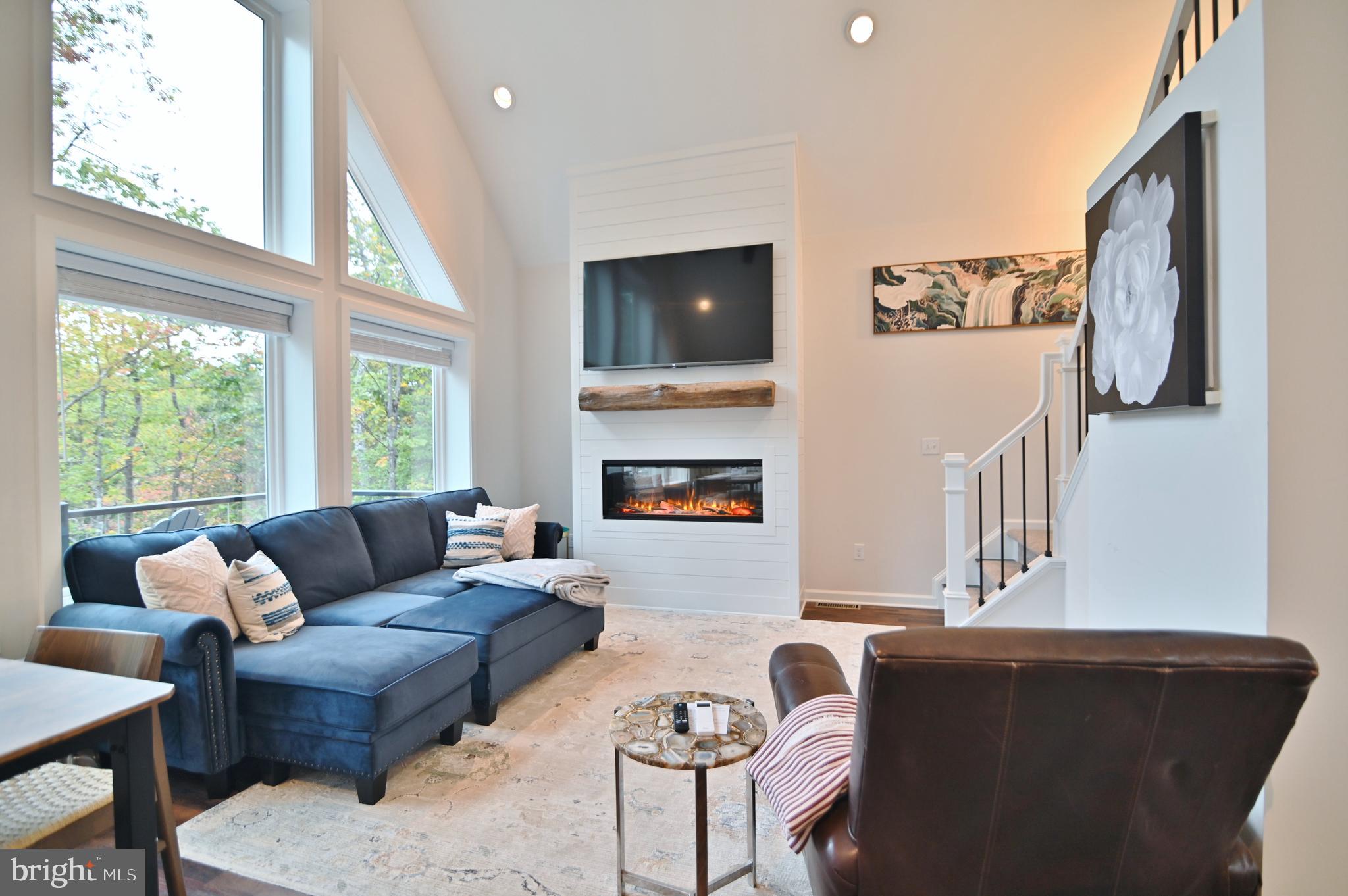 5448 Crooked Run Road Mount Jackson, VA 22842 - Photo 9 of 67 a living room with furniture and a flat screen tv