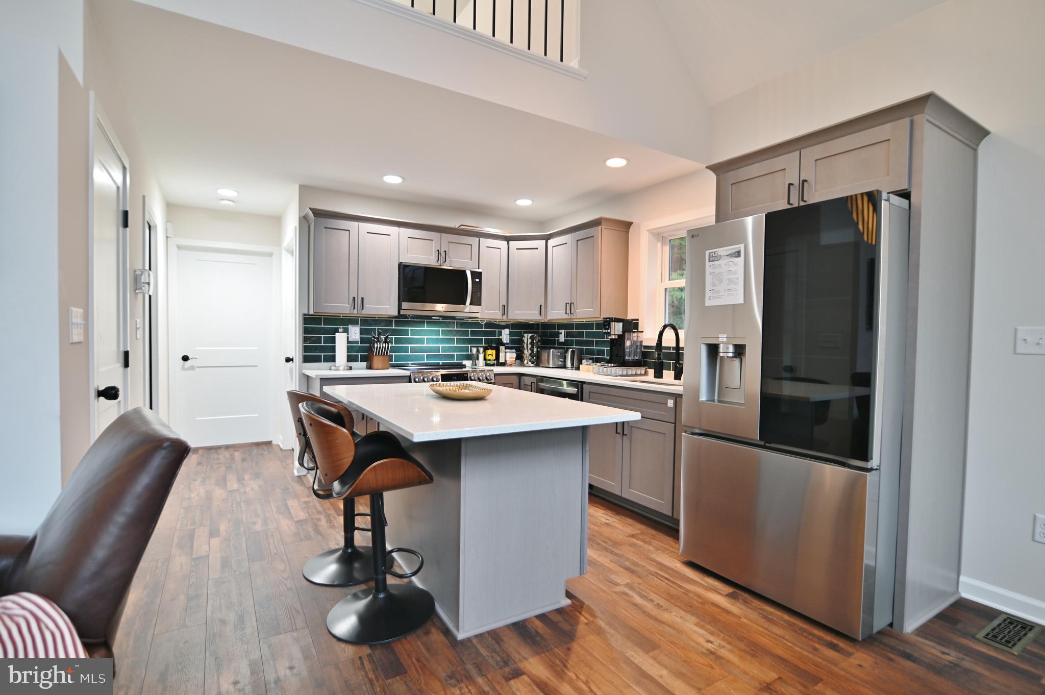 5448 Crooked Run Road Mount Jackson, VA 22842 - Photo 10 of 67 a kitchen with stainless steel appliances a refrigerator a stove a sink and a refrigerator