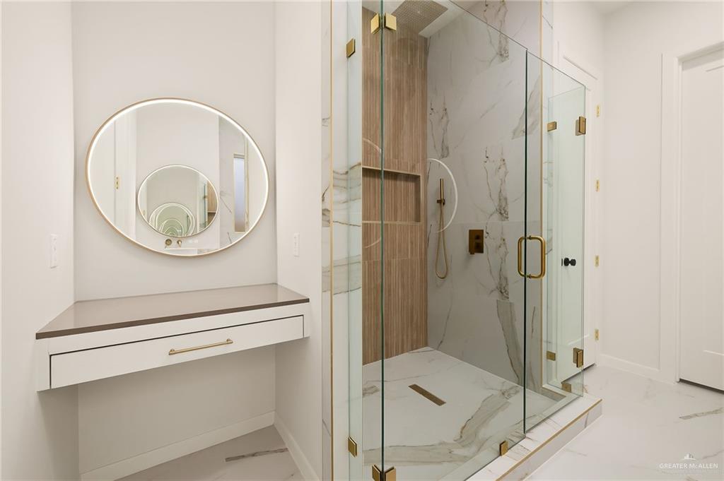 1107 Benjamin Street Mission, TX 78573 - Photo 13 of 19 Walk-in shower with clear glass enclosure and gold-toned hardware