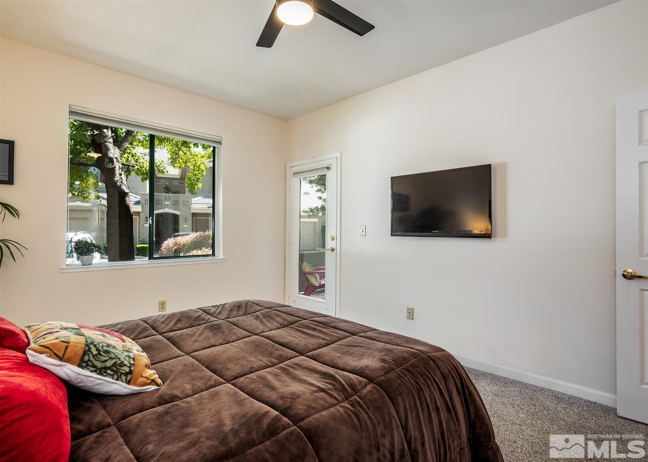 900 South, Unit 3413 Reno, NV 89521 - Photo 15 of 21 a bedroom with a bed and a flat screen tv