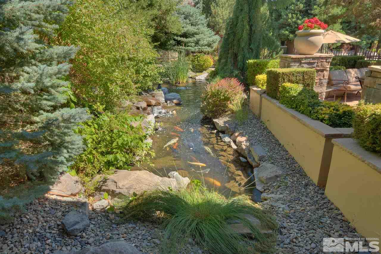 900 South, Unit 3413 Reno, NV 89521 - Photo 4 of 21 a view of a yard with plants and a lake view