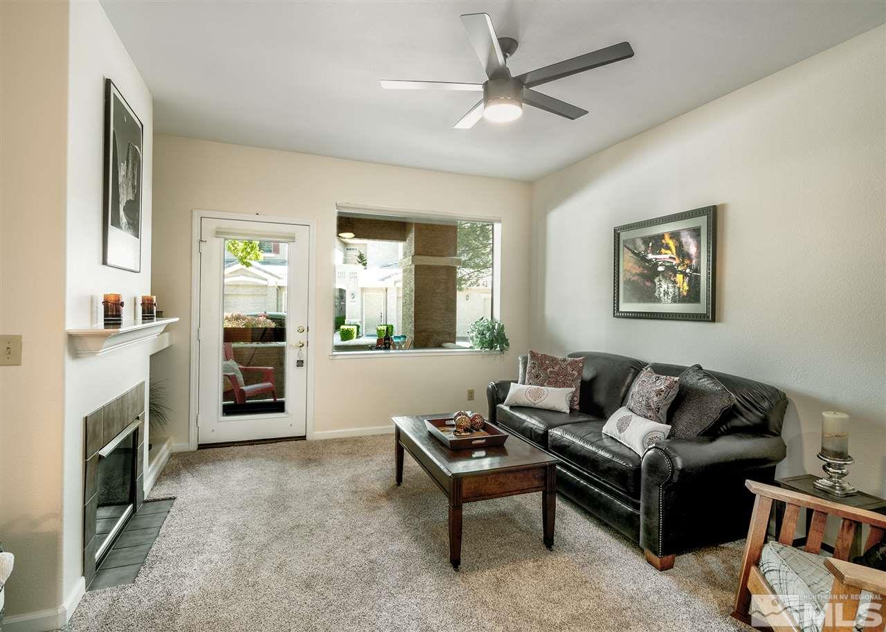 900 South, Unit 3413 Reno, NV 89521 - Photo 10 of 21 a living room with furniture and a fireplace