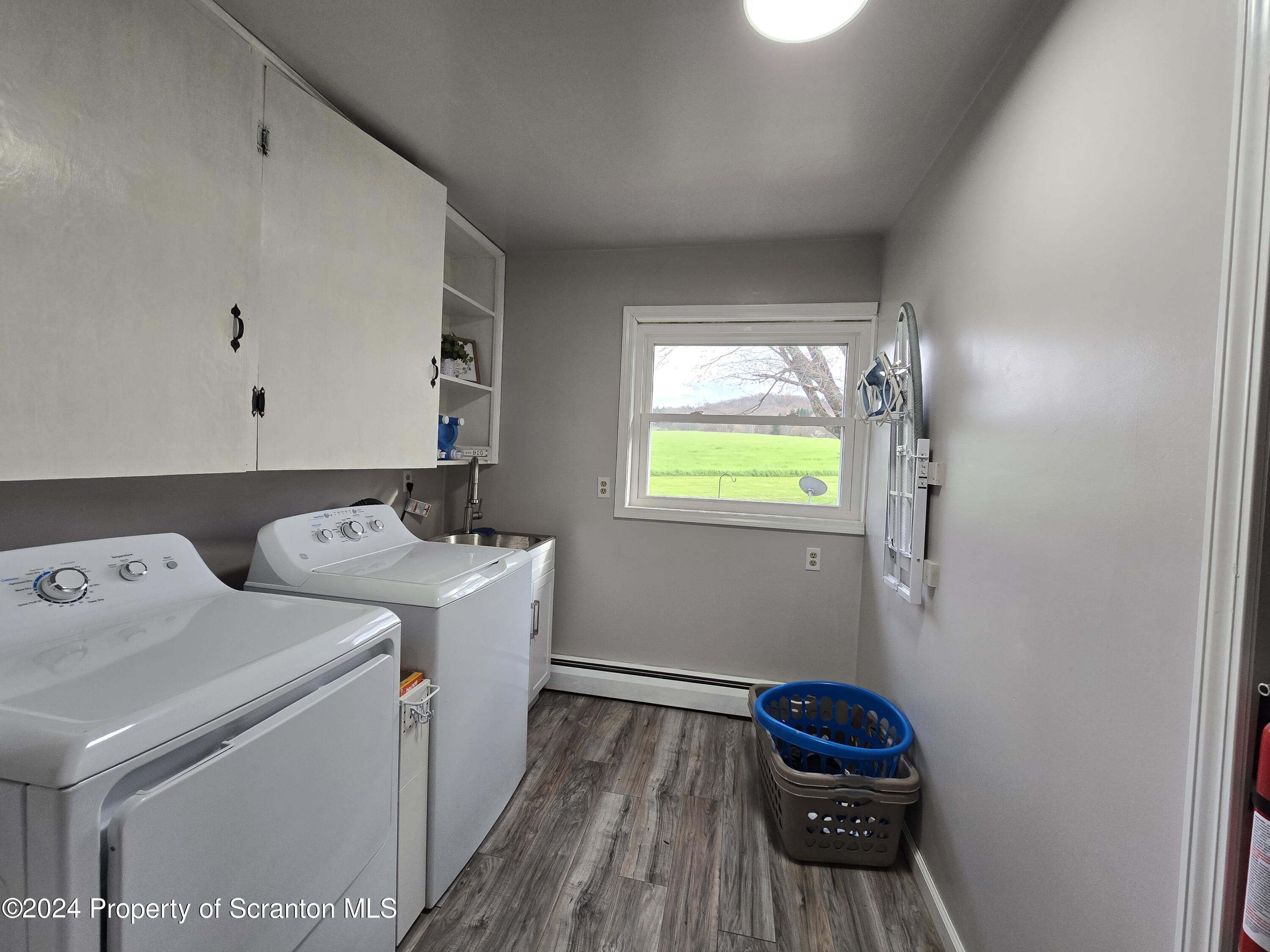 6736 Kingsley Road Kingsley, PA 18826 - Photo 21 of 42 a utility room with dryer and washer