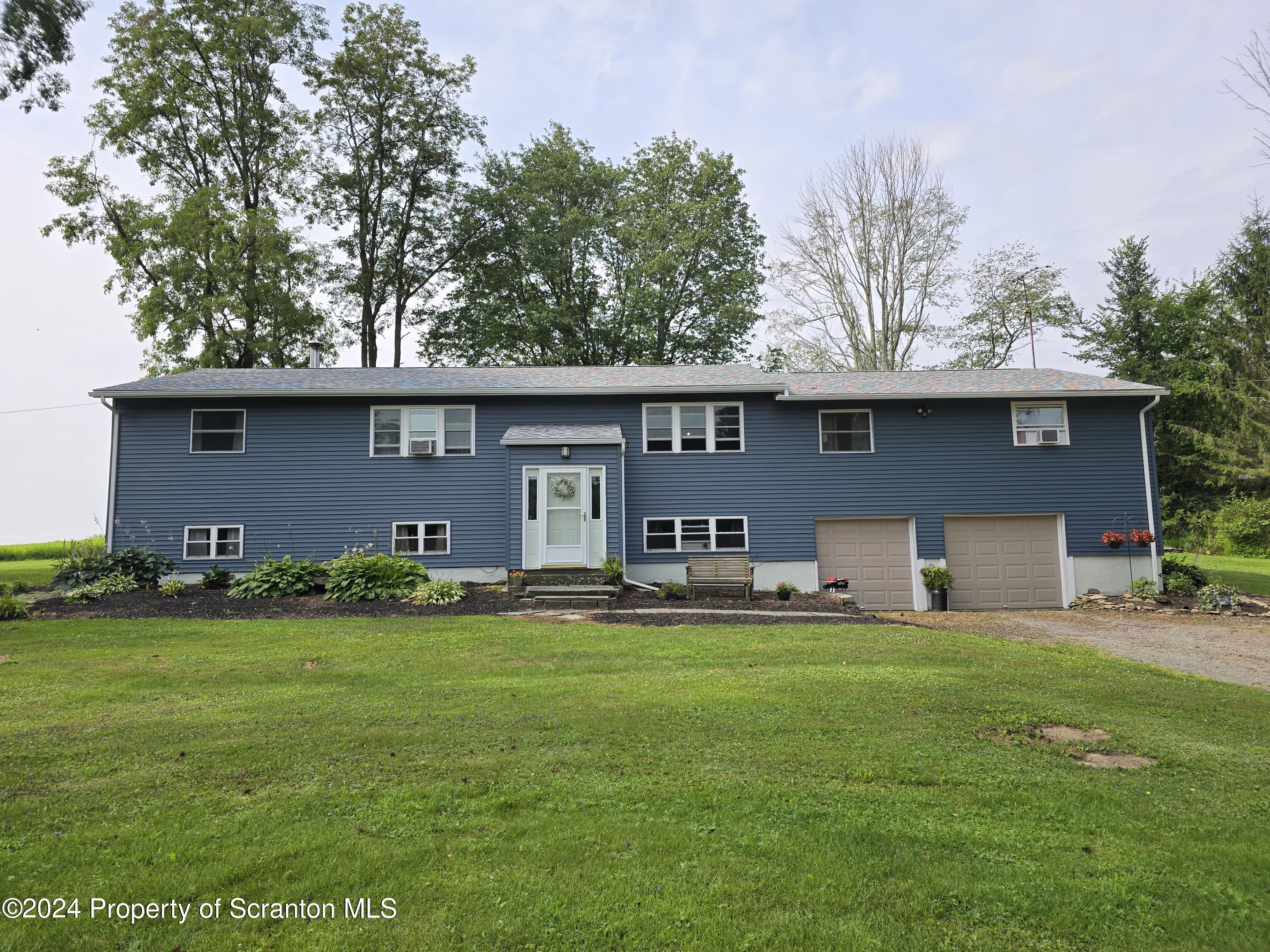 6736 Kingsley Road Kingsley, PA 18826 - Photo 41 of 42 a front view of house with yard and trees