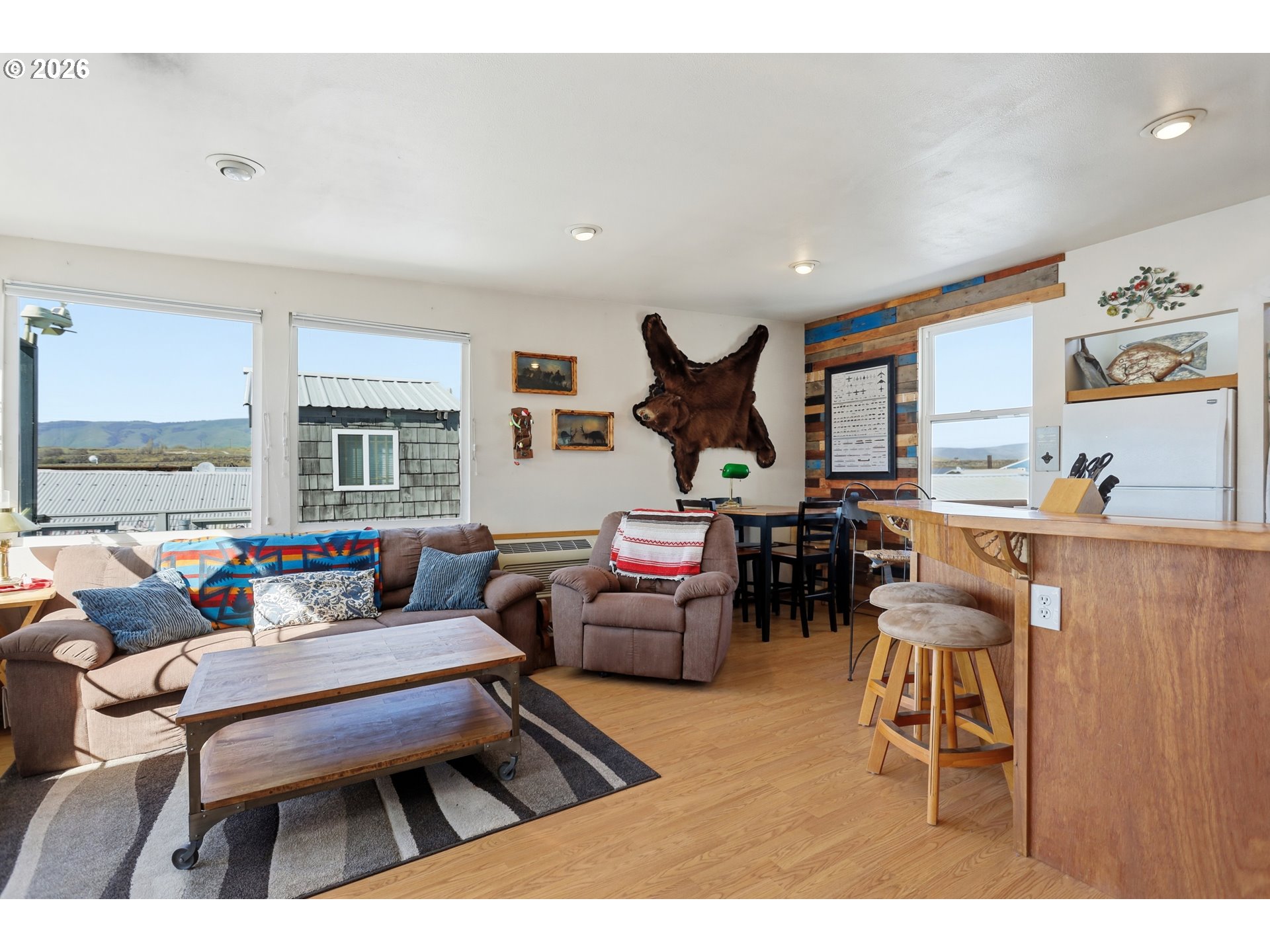 101 North Boat Basin Road, Unit C3 The Dalles, OR 97058 - Photo 12 of 44 a living room with furniture and a large window