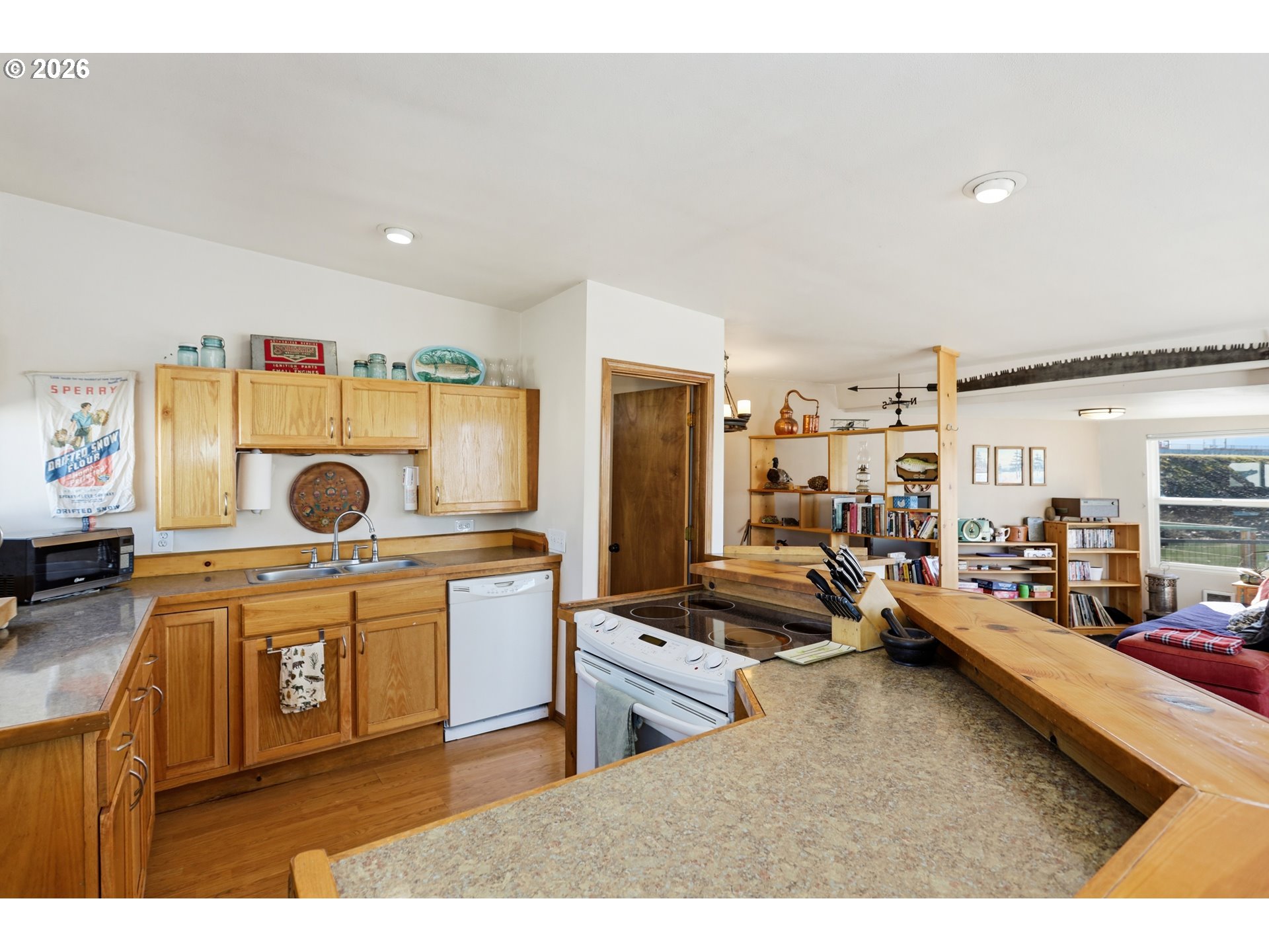 101 North Boat Basin Road, Unit C3 The Dalles, OR 97058 - Photo 16 of 44 a kitchen with a stove a cabinets and a view of living room