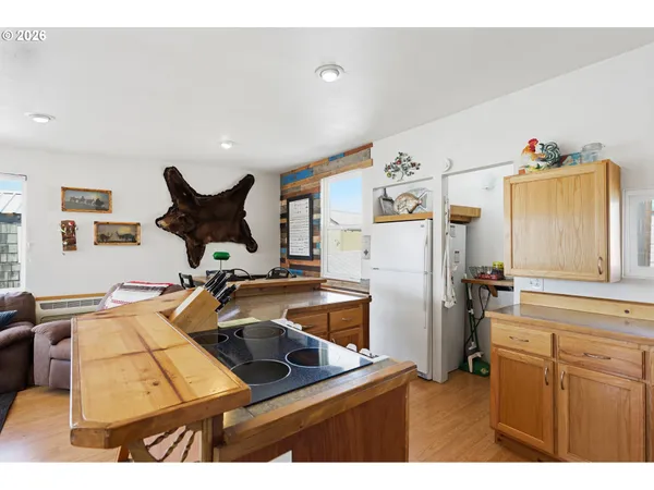 a kitchen with refrigerator and window