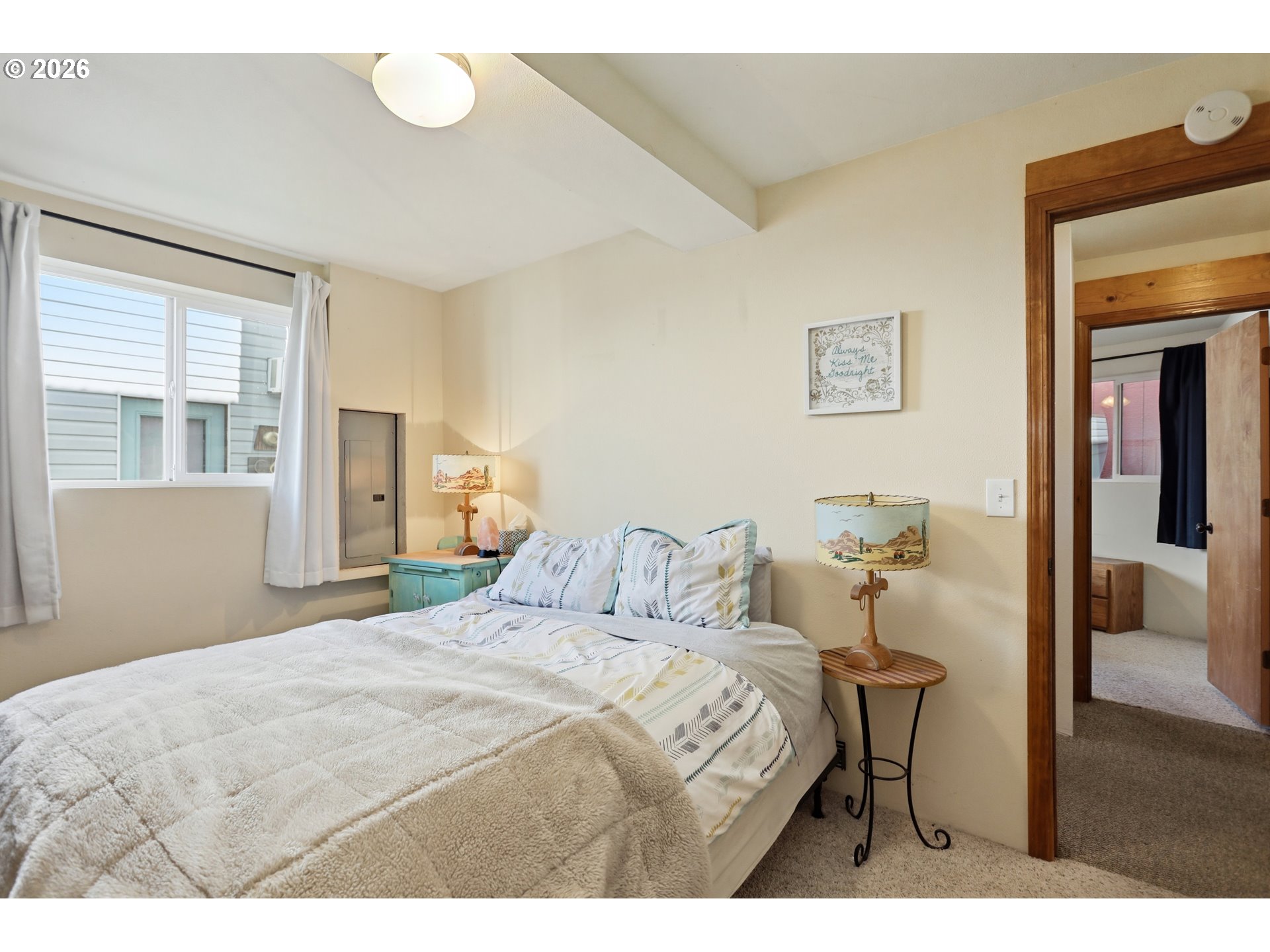 101 North Boat Basin Road, Unit C3 The Dalles, OR 97058 - Photo 25 of 44 a bedroom with a bed and wooden floor