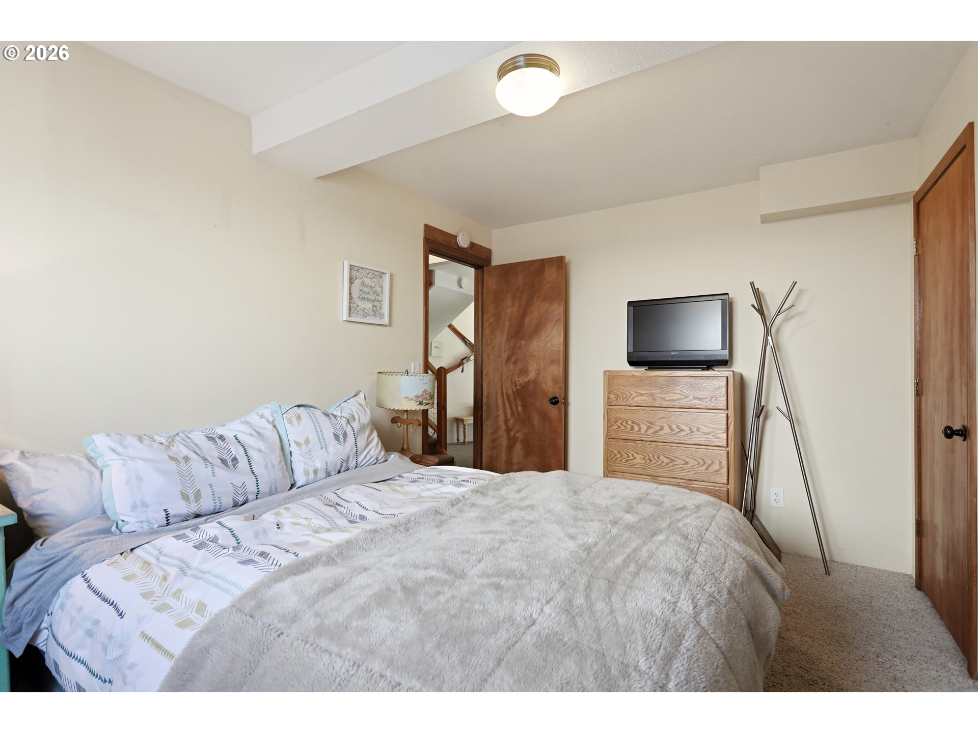 101 North Boat Basin Road, Unit C3 The Dalles, OR 97058 - Photo 26 of 44 a bedroom with a bed and a flat screen tv