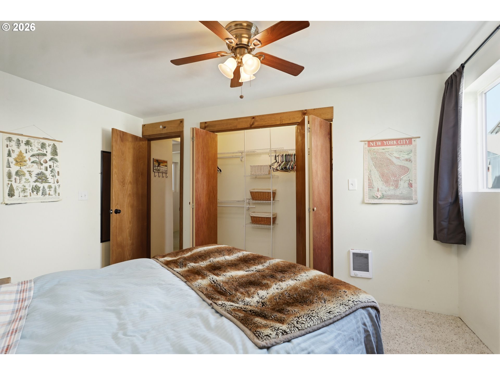 101 North Boat Basin Road, Unit C3 The Dalles, OR 97058 - Photo 27 of 44 a bedroom with a bed and a chandelier