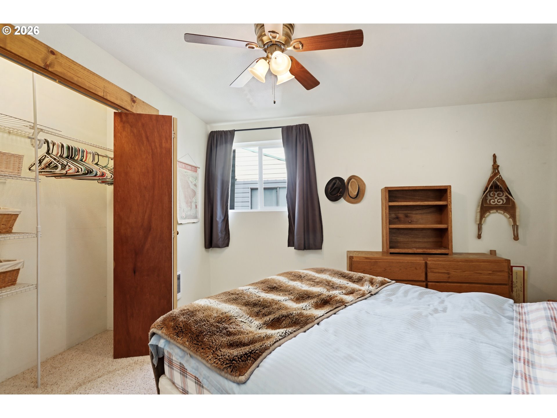 101 North Boat Basin Road, Unit C3 The Dalles, OR 97058 - Photo 28 of 44 a bedroom with a bed and a chandelier