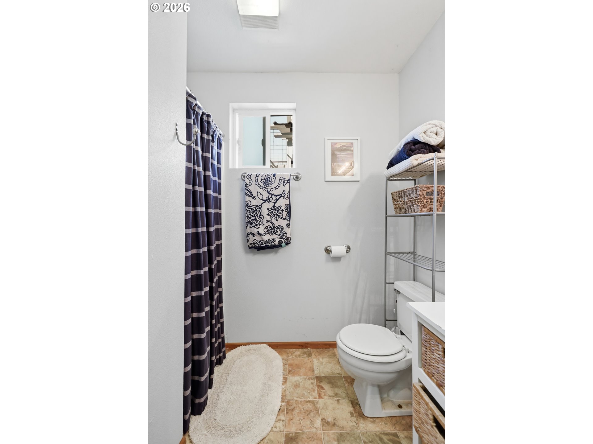 101 North Boat Basin Road, Unit C3 The Dalles, OR 97058 - Photo 31 of 44 a bathroom with a toilet and a shower curtain