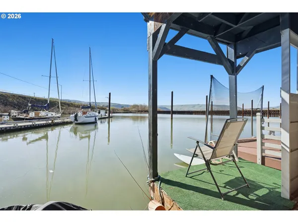 a view of a swimming pool with outdoor seating