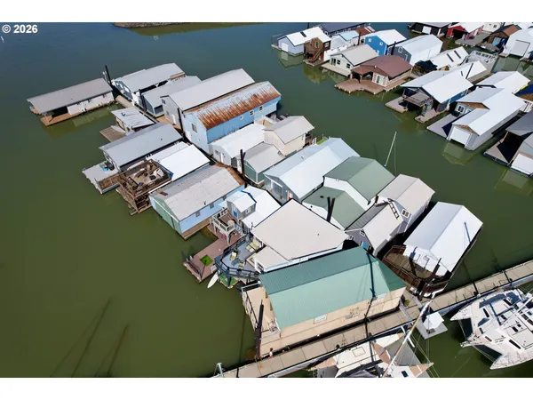 an aerial view of a house with a ocean view