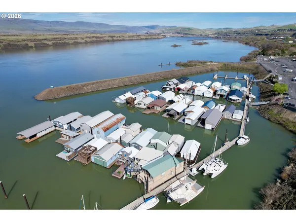 an aerial view of a house with a ocean view