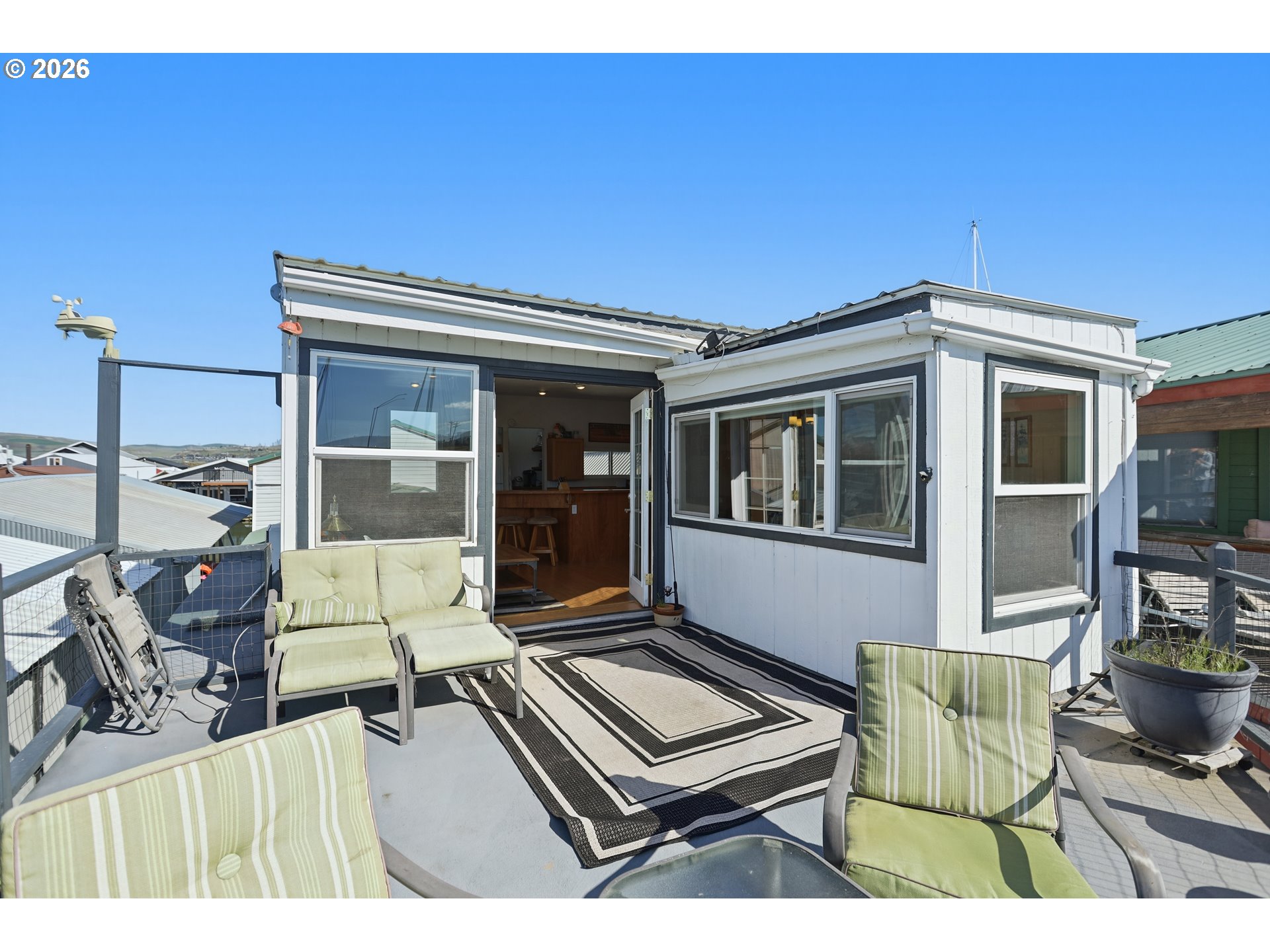 101 North Boat Basin Road, Unit C3 The Dalles, OR 97058 - Photo 10 of 44 a view of an chairs and tables in the patio