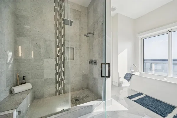 a bathroom with a shower and a toilet