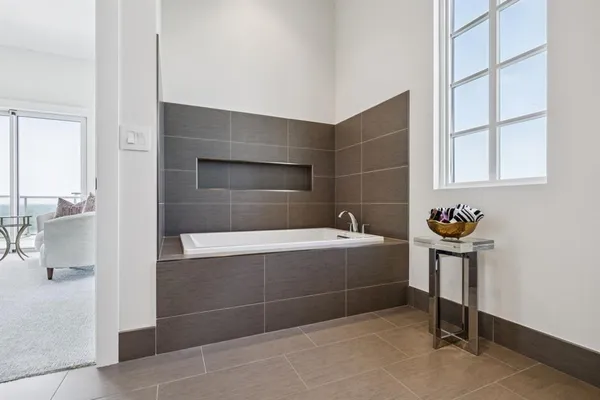 a bathroom with a bathtub and a sink