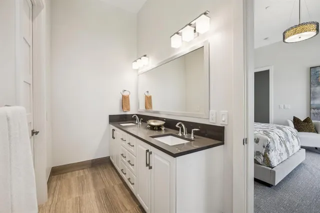 a view of a livingroom with furniture and a bathroom