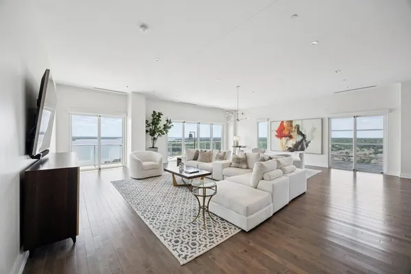 a living room with fireplace furniture and a flat screen tv