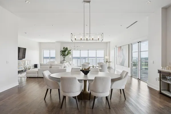 a view of a dining room with furniture window and wooden floor