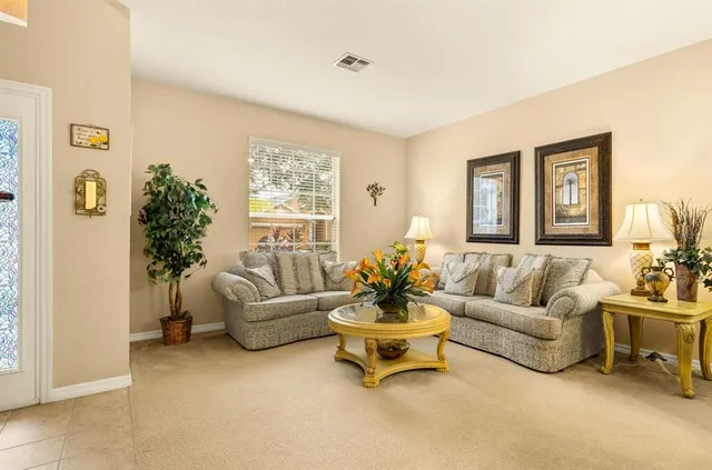 a kitchen with a refrigerator and a sink
