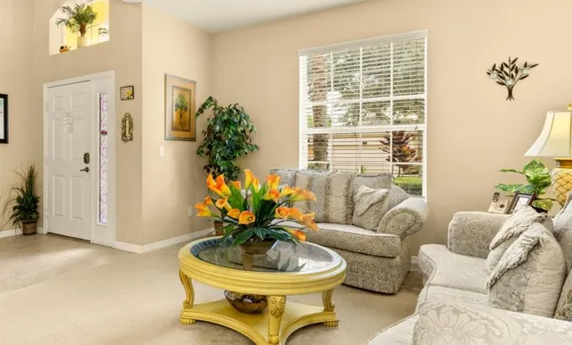 a living room with furniture and a table