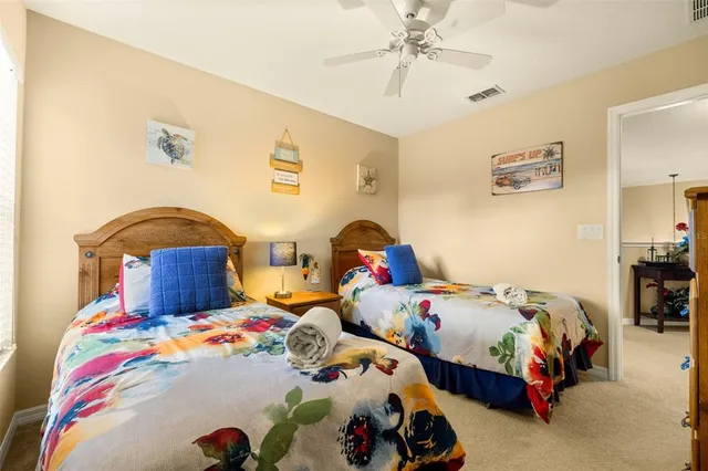 a en suite bathroom with a double sink and mirror