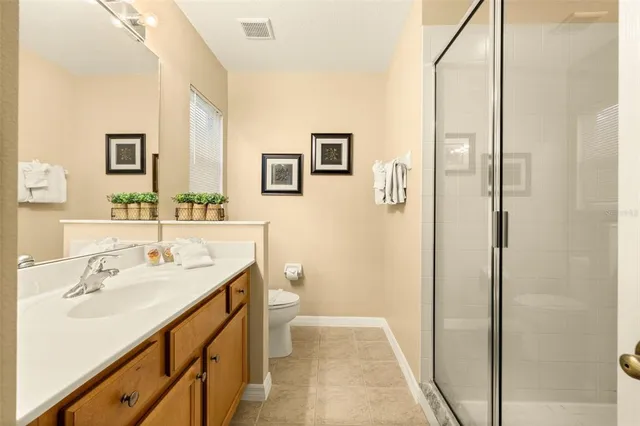 a view of a swimming pool with a patio and a yard