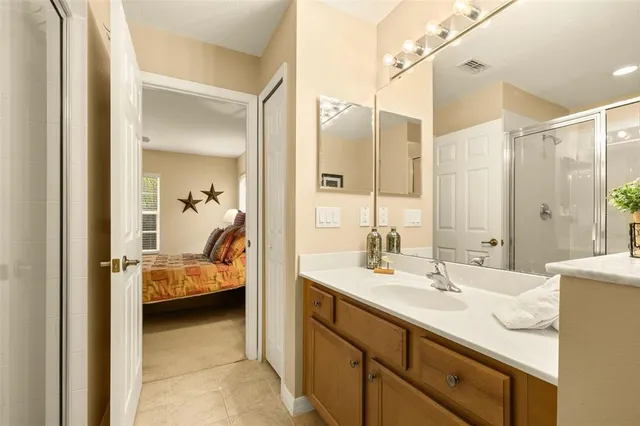 a view of a swimming pool with a yard and plants