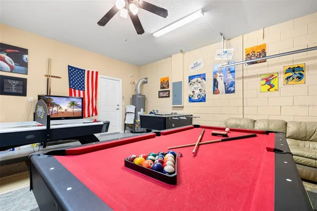 a view of swimming pool with outdoor seating and yard in the back