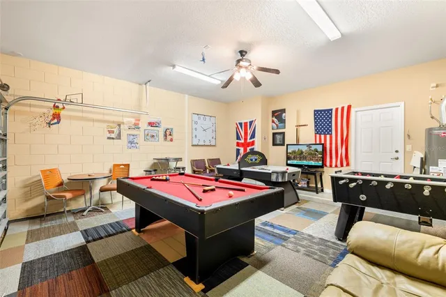 a view of swimming pool with outdoor seating and city view