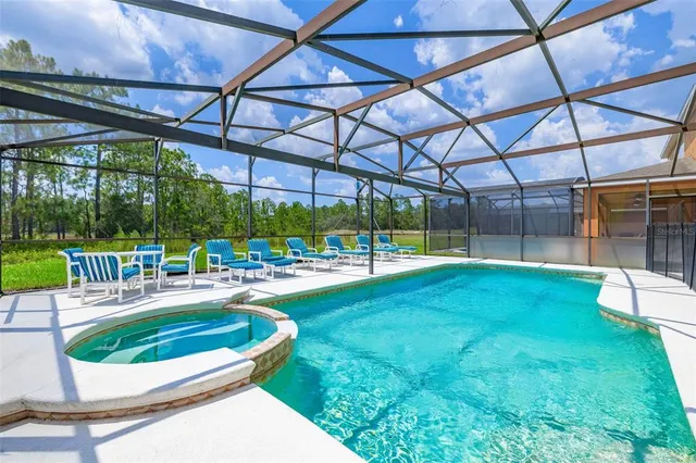 a view of a patio with a table chairs and a garden