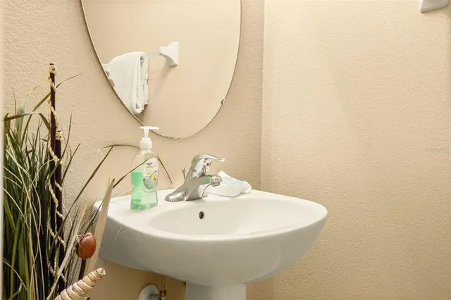 a view of a park with slide and potted plants
