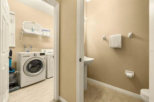 a view of a house with a swimming pool and a yard