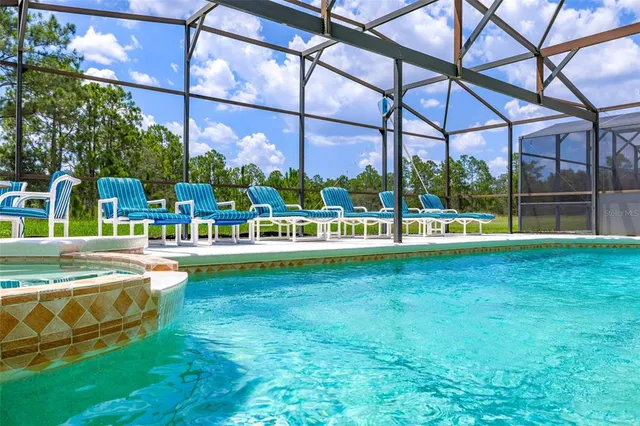 a view of yard with swimming pool