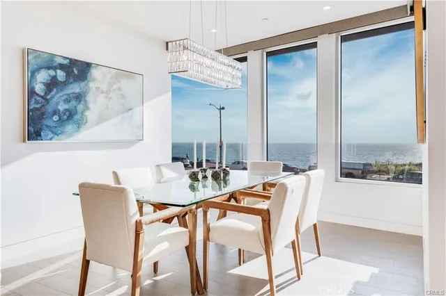 a view of a dining room with furniture and a large window