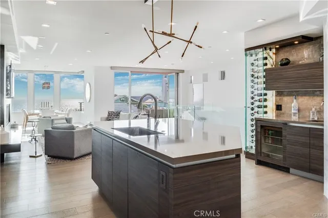 a kitchen with counter top space sink and stove