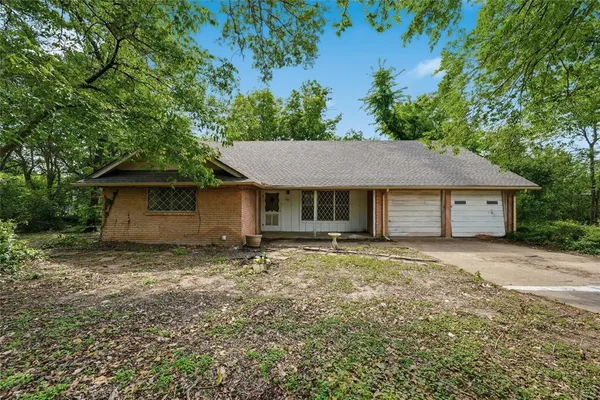 a house with trees in the background