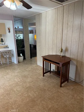 a view of a livingroom with furniture and staircase