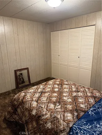 a bedroom with a bed and a shower