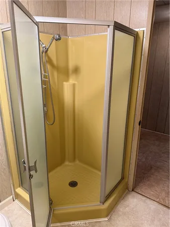 a bathroom with a shower and a sink