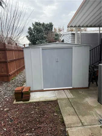 a view of a backyard of the house