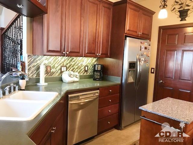 59373 Hop Patch Spring Road Mountain Center, CA 92561 - Photo 13 of 41 a kitchen with stainless steel appliances granite countertop a refrigerator and a sink