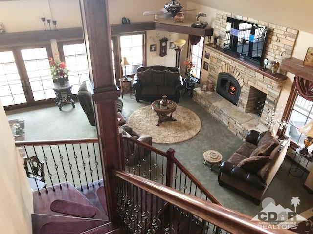 59373 Hop Patch Spring Road Mountain Center, CA 92561 - Photo 17 of 41 a living room with furniture and a fireplace